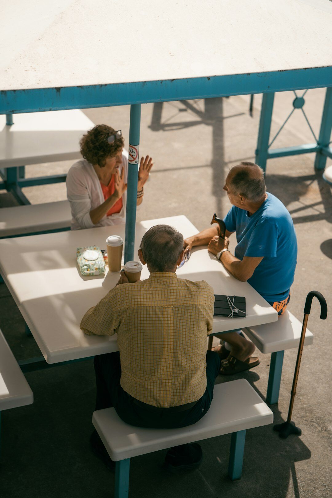 Team of colleagues discussing technology news around a table