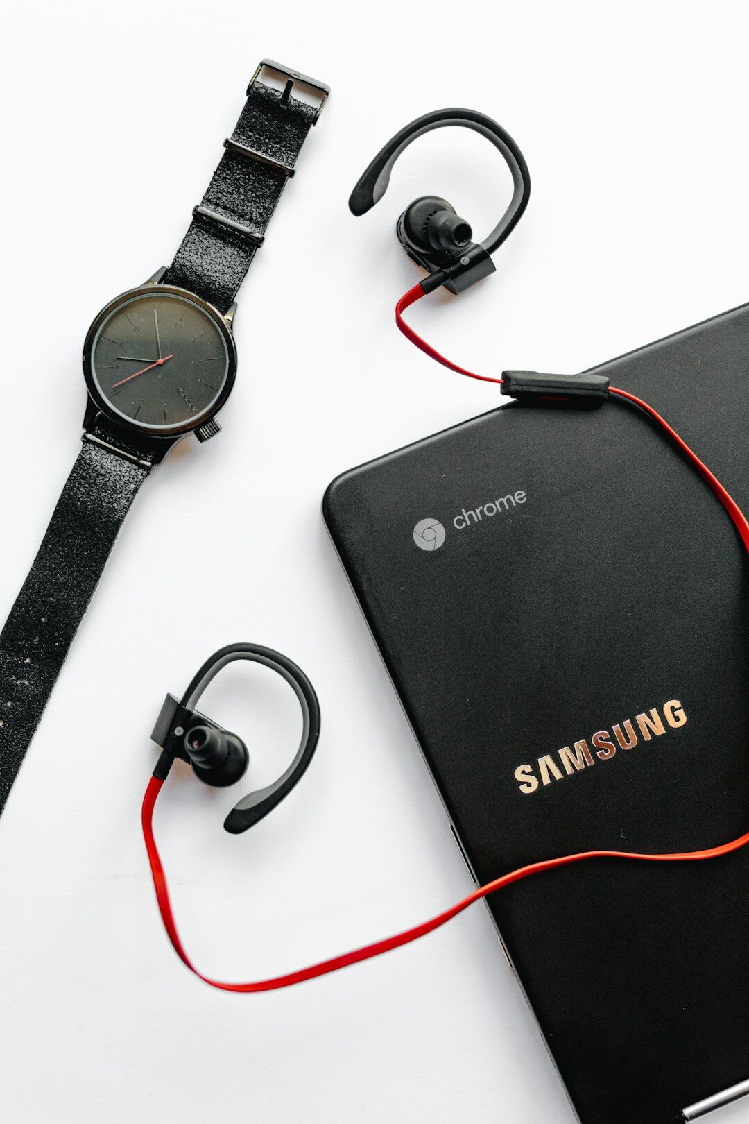 Flat lay of smartphone, smartwatch and wireless headphones